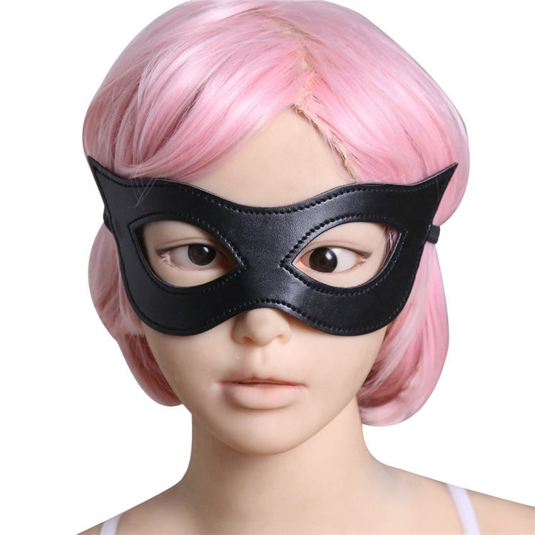 Mannequin wearing pink hair and a black blindfold