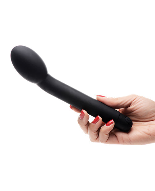 Black handheld massager held by a hand with red nail polish on a white background
