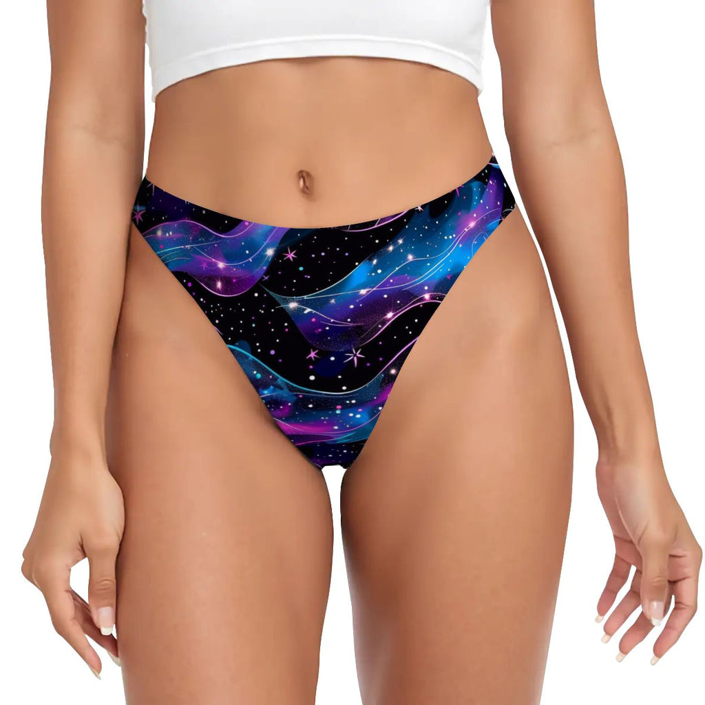 Colorful galaxy-patterned bikini bottom worn by a person on a white background