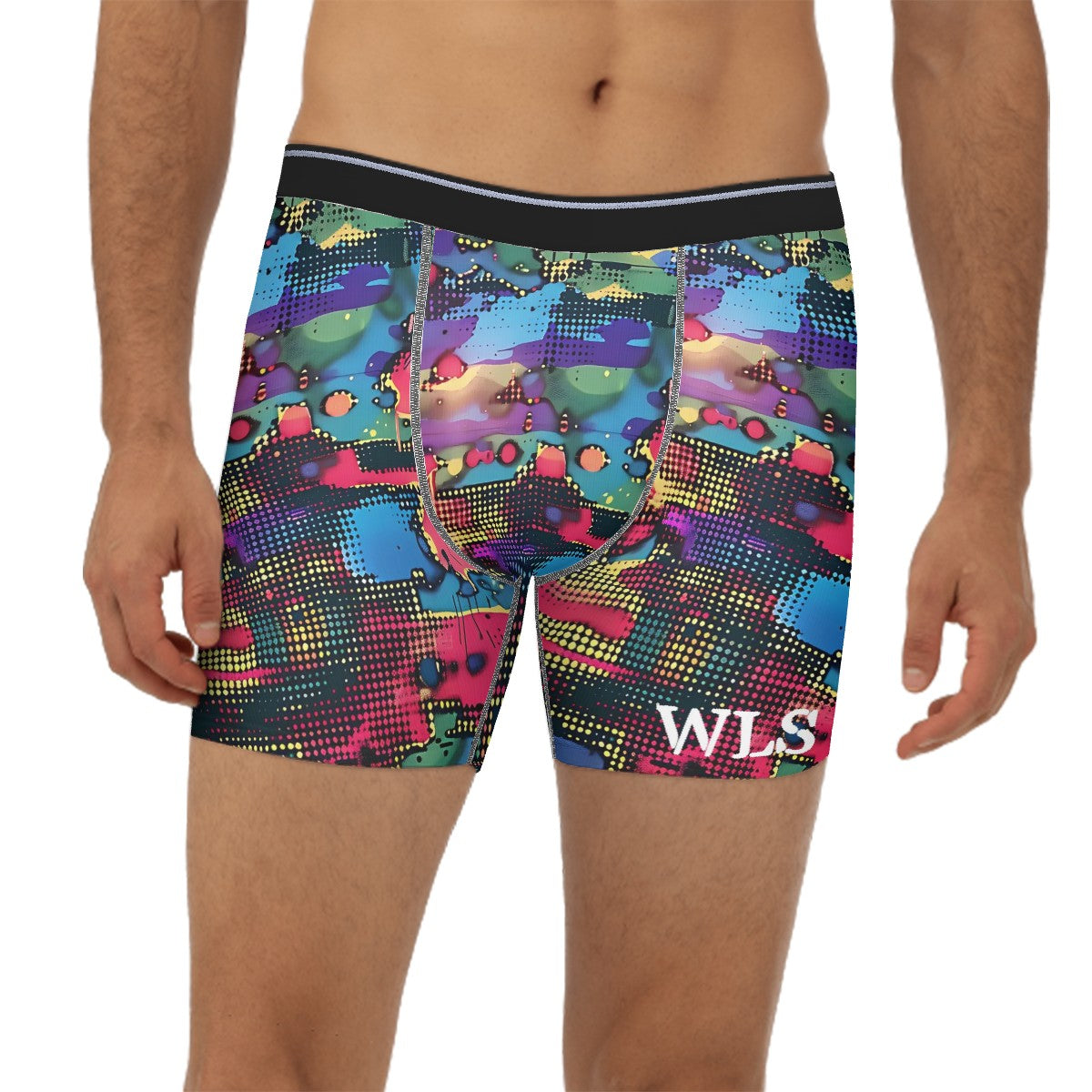 Man standing near a wall wearing Wicked Lifestyle's Collection colorful boxer briefs.