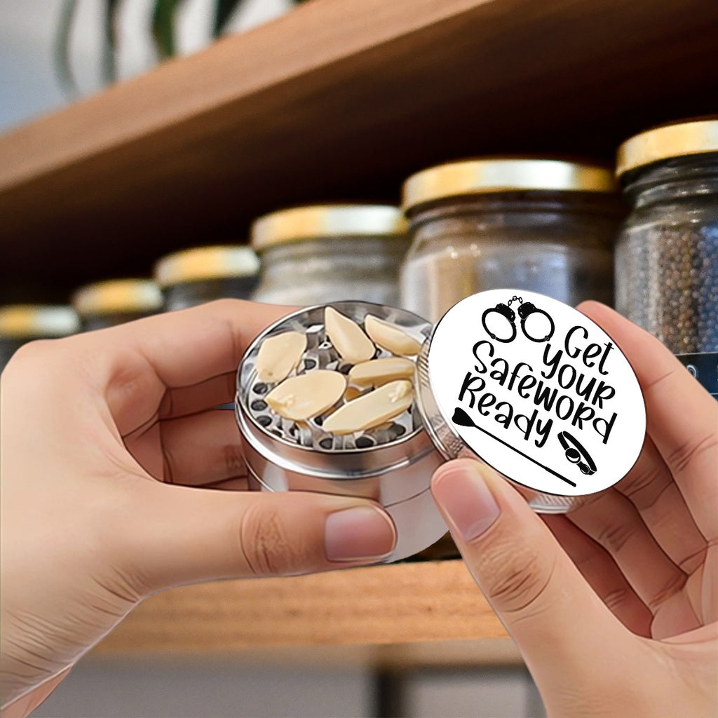 Someone holding herb grinder that has "Get Your Safeword Ready." BDSM inspired herb grinder. 