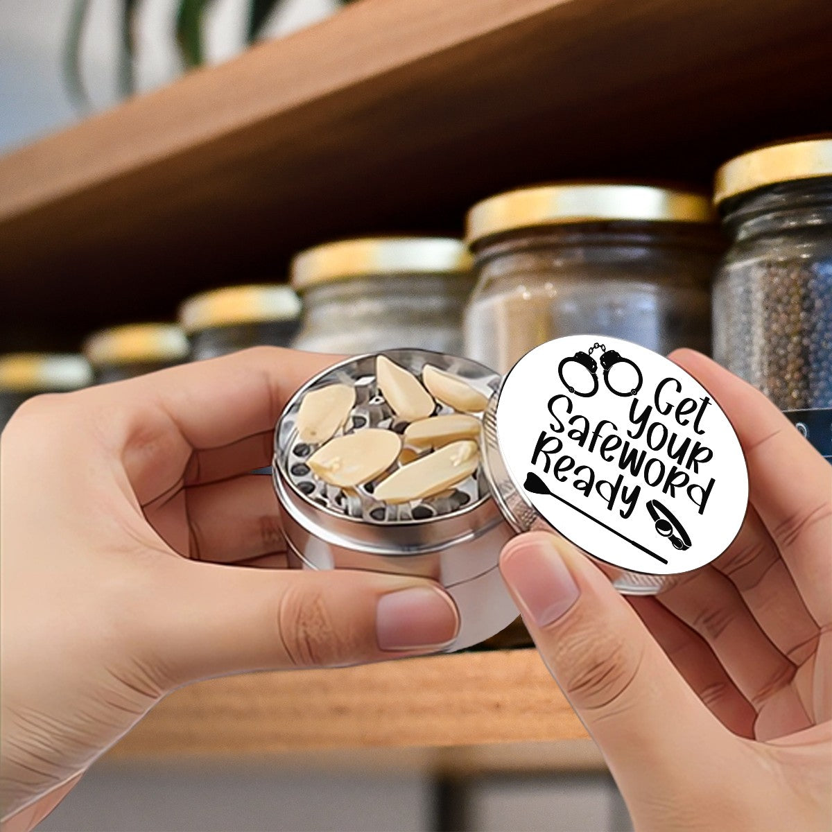 Someone holding herb grinder that has "Get Your Safeword Ready." BDSM inspired herb grinder. 