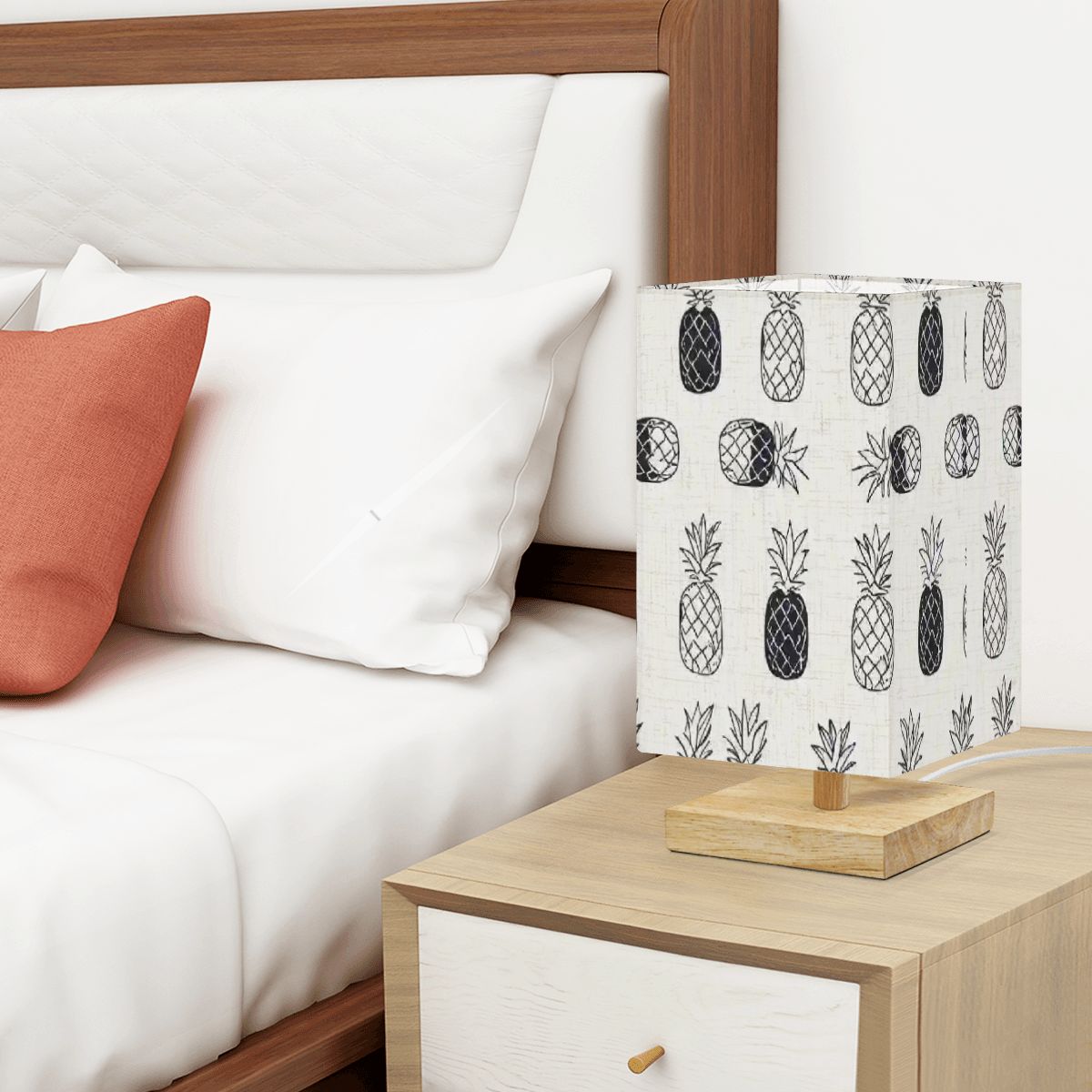 Pineapple inspired lamp sitting on an end table of a high-end room or apartment. Looks very elegant with perfect placement.